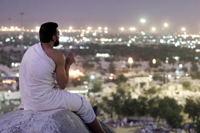 Hajj pilgrim prays on Mt. Arafat