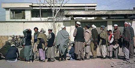 Afghans line up for aid on the Eid