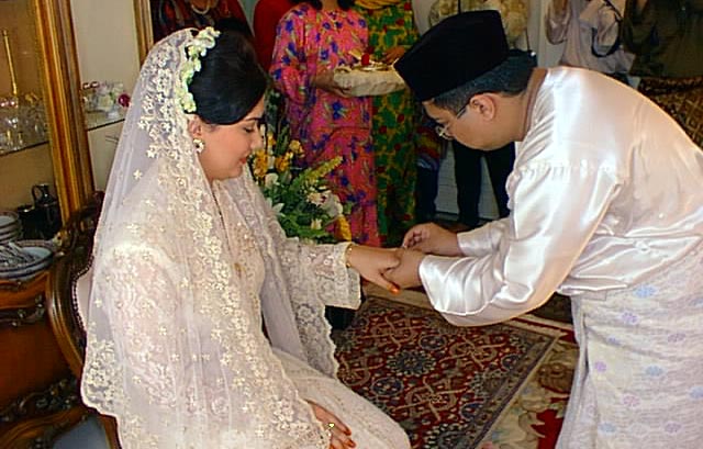 Bridegroom Placing the Wedding Ring on the Bride's Finger