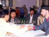 Shaking hands during the performance of the nikah