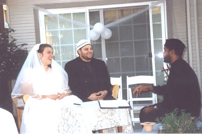 The bride, the groom, and Amir Abdul Malik Ali
