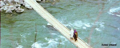Crossing a bridge in Kashmir