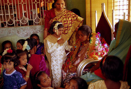 Men and the groom pray in a colorful muslim wedding in south Karnataka