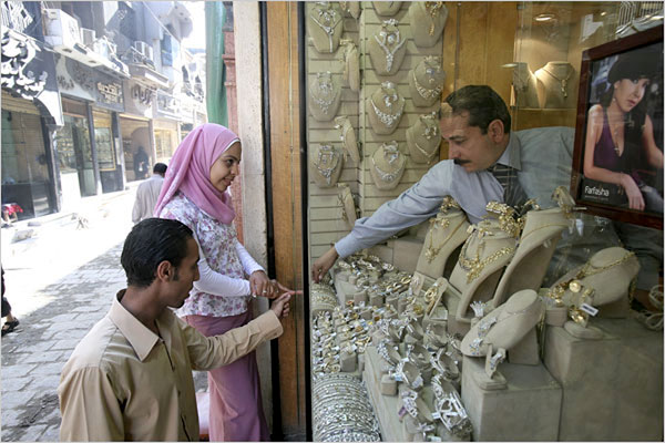  21 looked at engagement rings and other jewelry at a shop in Cairo