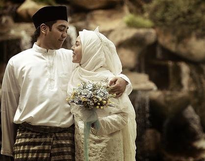 A Malaysian Muslim couple at their wedding A Malaysian Muslim couple at their wedding