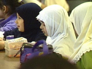 Muslim girls having lunch at school
