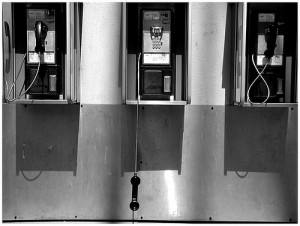 Payphone hanging off the hook