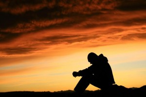 sad man sitting thinking