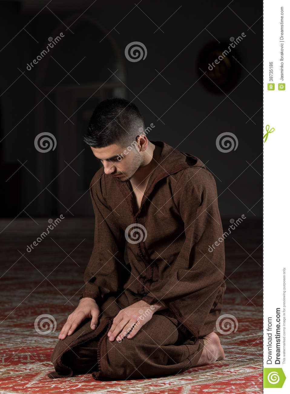 muslim-man-praying-mosque-young-making-traditional-prayer-to-god-wearing-traditional-cap-djellaba-38735186