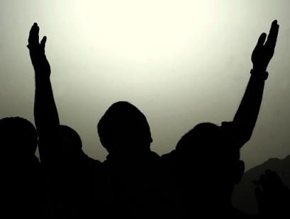 A man prays on Mt. Arafat during the Hajj