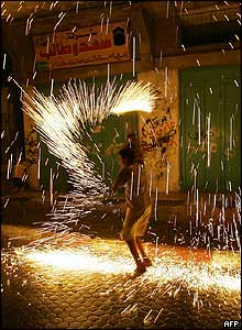 A child plays with fireworks in Gaza City