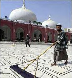 Sweeping the masjid courtyard