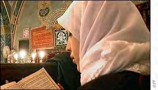 Turkish woman reading Qur'an