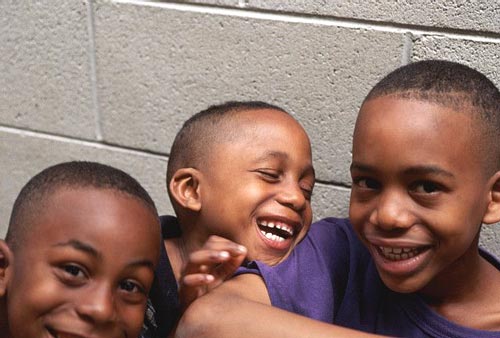 Three joyful boys playing