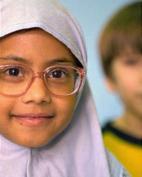 A smiling Muslim girl wearing hijab