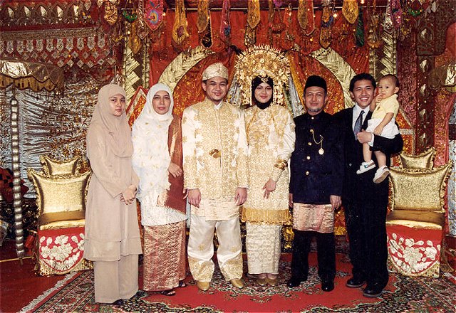 Bride and groom with Harry's family