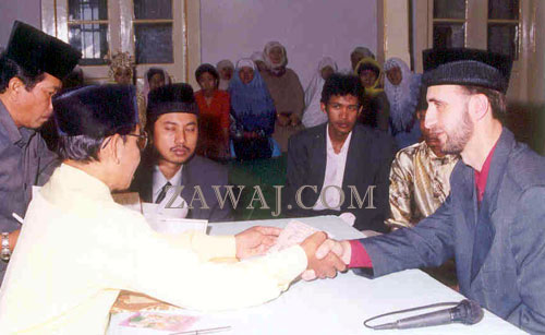 Shaking hands during the performance of the nikah