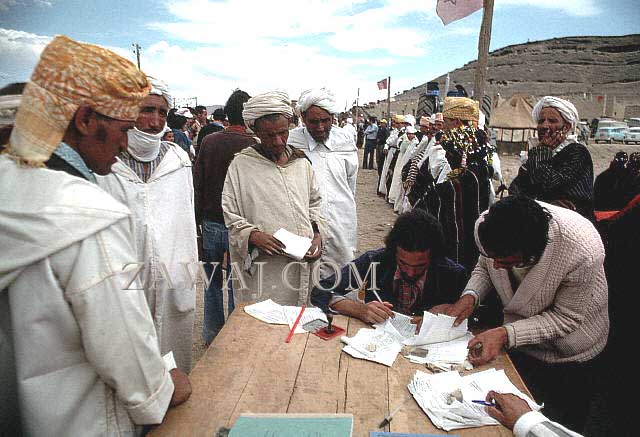 Men signing marriage documents